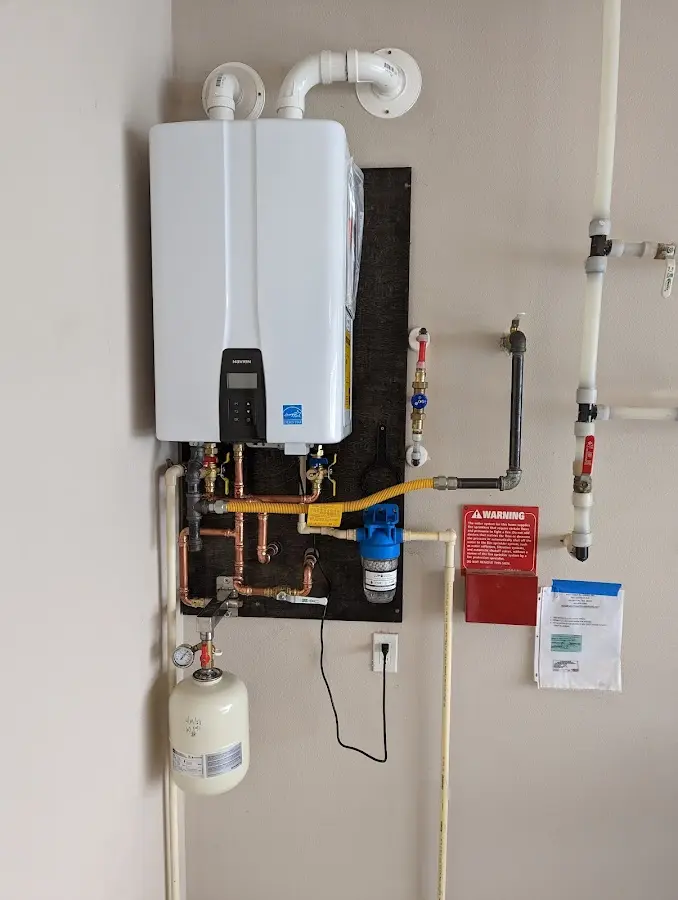 Professional plumber installing copper piping in a Boerne home